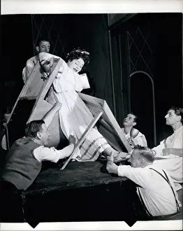 Outsize: Hattie Jacques on step ladder with prop men
