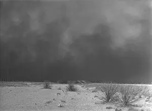 Panhandle: Heavy black clouds of dust rising over the ?