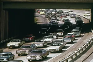 Workplaces: Heavy rush hour traffic as commuters drive ?