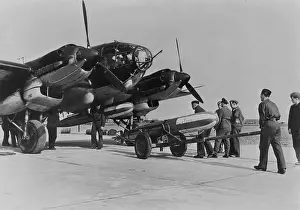 Torpedoes: Heinkel He 111 is loaded with a torpedo, 1940
