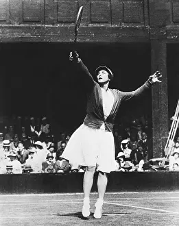 20 29: Helen Wills Moody returning a high one during her