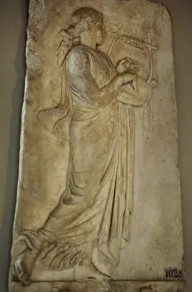 Muse: Hellenistic relief depicting a Muse playing the zither