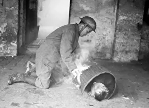 Someone: Helping someone on fire, ARP training exercise during WW2