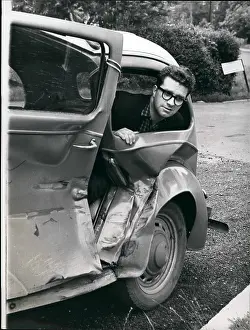 Unhurt: Henry Cooper and his battered Ford Popular