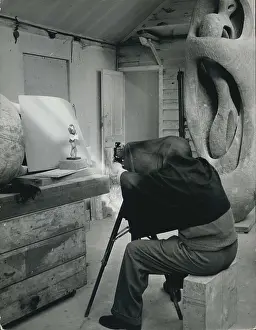 Disappears: Henry Moore, sculptor, photographing his own work