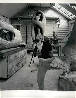 Cowl: Henry Moore, sculptor, photographing his own work