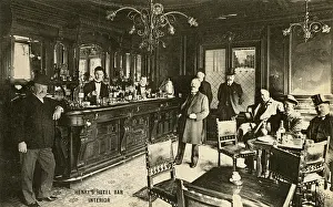 Barman: Henry's hotel bar interior. Paris