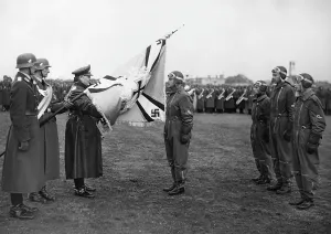 Handover: Hermann Goering hands over a flag, 1938
