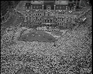 Starts: High Angle Shot of a Crowd at the Town Square