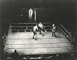 Adversity: High angle view of boxing match