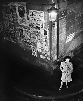 Aloneness: High angle view of a young woman waiting next to