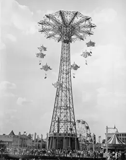 Carnivals: High flying parachute chairs ride at funfair