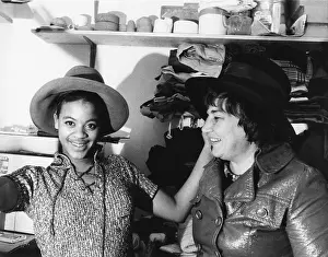 Abzug: A high school student tries on one of Bella Abzug's