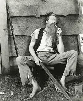 Penniless: Hillbilly smokes clay pipe -