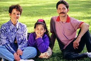 Latina: Hispanic Father Mother and Daughter Sitting in