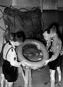 Lifeboat: Hitler boys with a lifebuoy from the Bismarck, 1941