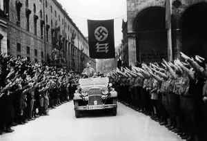 Triple: Hitler at a celebration to commemorate the