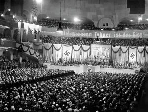 Garlands: Hitler giving a speech at a NSDAP rally in
