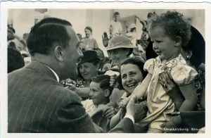 Deliberately: Hitler greeting a small child in a crowd