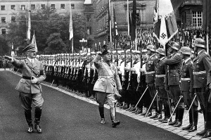 Fore: Hitler and Mussolini pace off the Guard of Honour in Munich