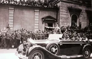 Prinzregentenplatz: Hitler saluting crowd from car, Munich