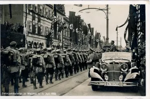 Thuringian: Hitler saluting from his Mercedes to a marching column