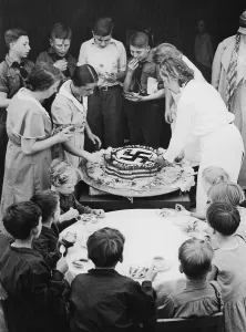 Share: Hitler's birthday cake is being shared, 1934