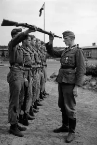 Pre Military: HJ members at roll call in the military training camp, 1