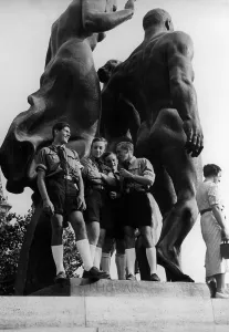 Adolescents: HJ members in front of Thorak statue at Parisian