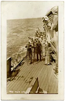 Ceres: HMS Cardiff, British cruiser, with film crew at work on deck
