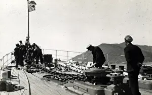 Danae: HMS Dunedin, British light cruiser, with crew