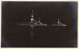 Nightime: HMS Marlborough and HMS Ajax illuminated at night
