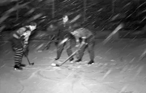 Flakes: Hockey game in snow storm