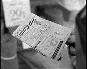 Someone: Someone Holding a Clothing Ration Book