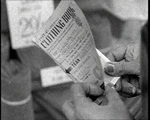 Someone: Someone Holding a Clothing Ration Book