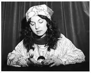 Interprets: HOLDING A CRYSTAL BALL