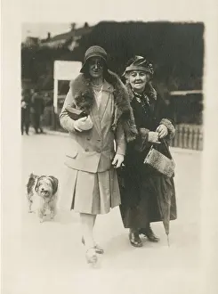 190s: Holidaymakers (and dog) stroll along the seafront