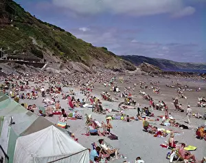 Lilo: Holidaymakers on the beach at Looe, Cornwall