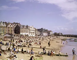 Windbreaker: Holidaymakers on the beach, St Ives, Cornwall