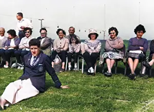 Redcoat: Holidaymakers and a Redcoat at Butlin's holiday camp