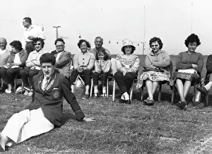 Redcoat: Holidaymakers and a Redcoat at Butlin's holiday camp