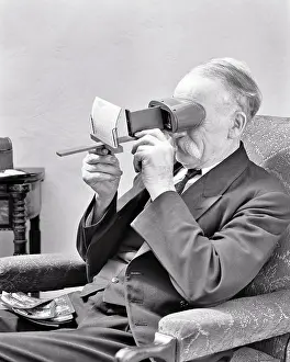 Oldsters: Home Entertainment Elderly Gentleman Sitting in