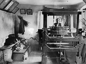 Cloths: Home weaver with loom, 1880