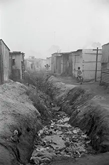 Ditches: Homes alongside a watery ditch, SOWETO