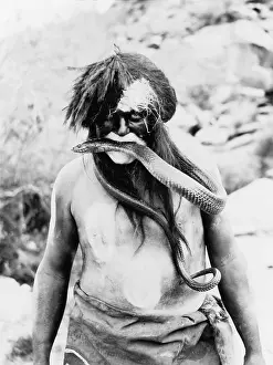Hopi: Hopi Indian with painted face and body and ?