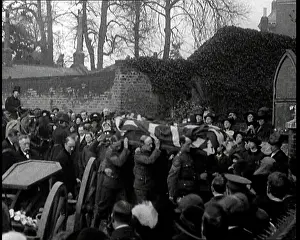 Draped: A Horse Drawn Gun Carriage is Stopped in Front
