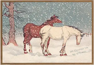 Two horses in the snow on a Christmas card