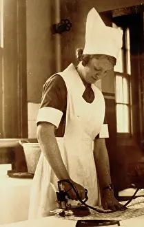 Chores: Hospital nurse doing some ironing