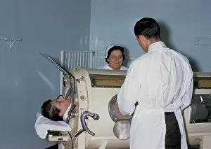 Externally: Hospital staff are examining a patient in ?