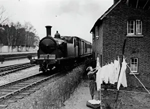 Washday: House by railway line